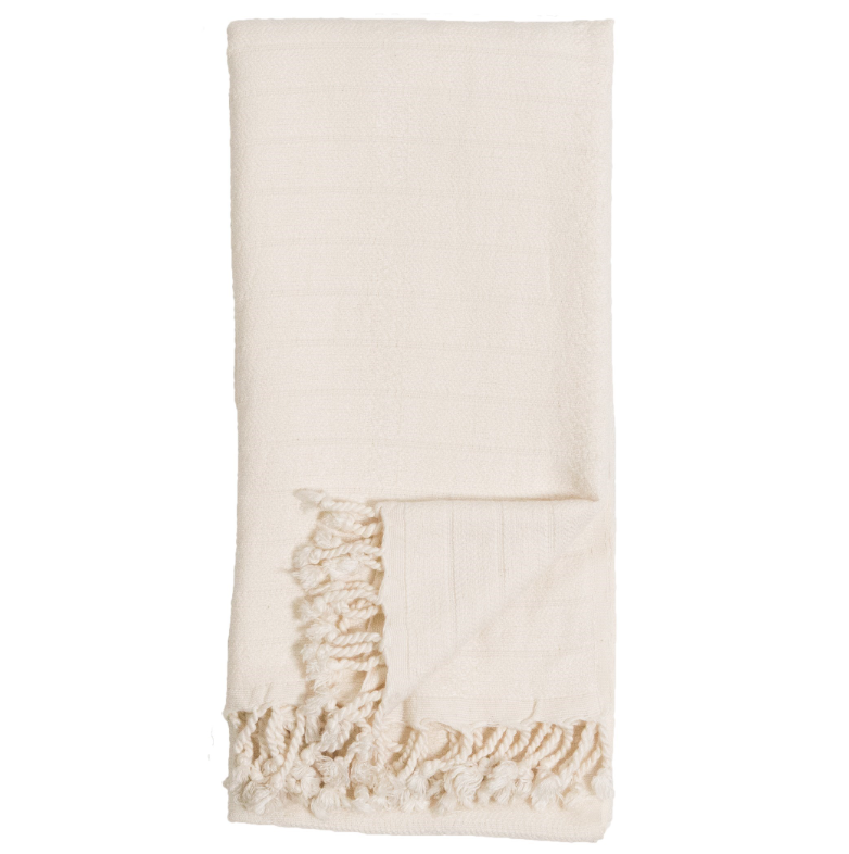 Beige towel with lace trim on a white background