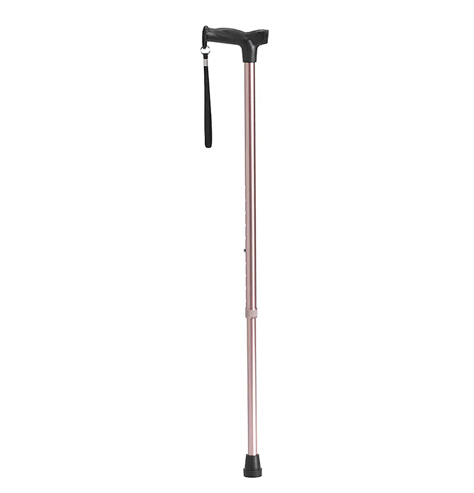 Rose gold walking cane with black handle on a white background