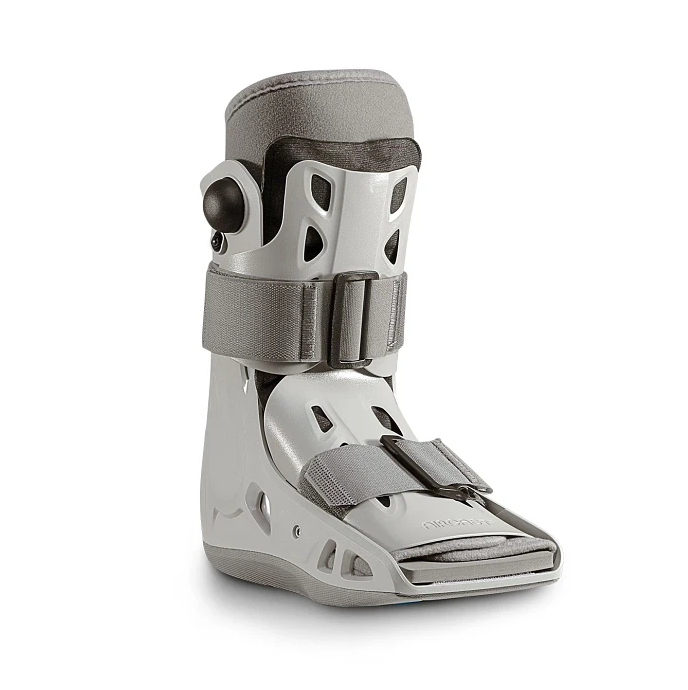 Gray orthopedic boot with straps on a white background