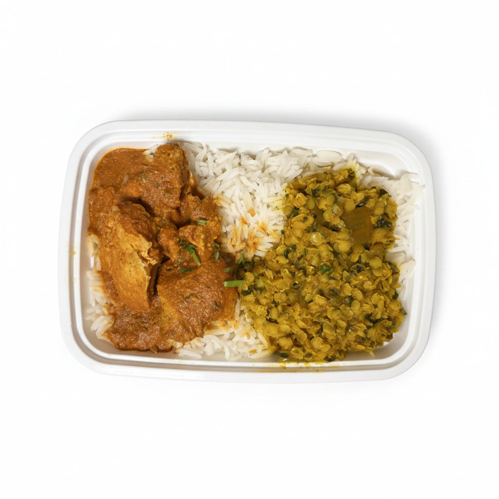 Container of food with butter chicken and lentils