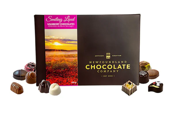 Newfoundland Chocolate Company packaging with chocolates around on a white background
