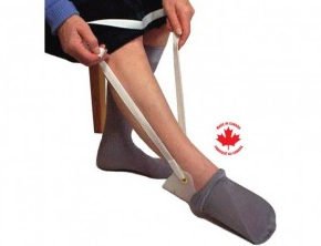 Person using a sock aid to put on socks with a Canadian flag logo in the corner.
